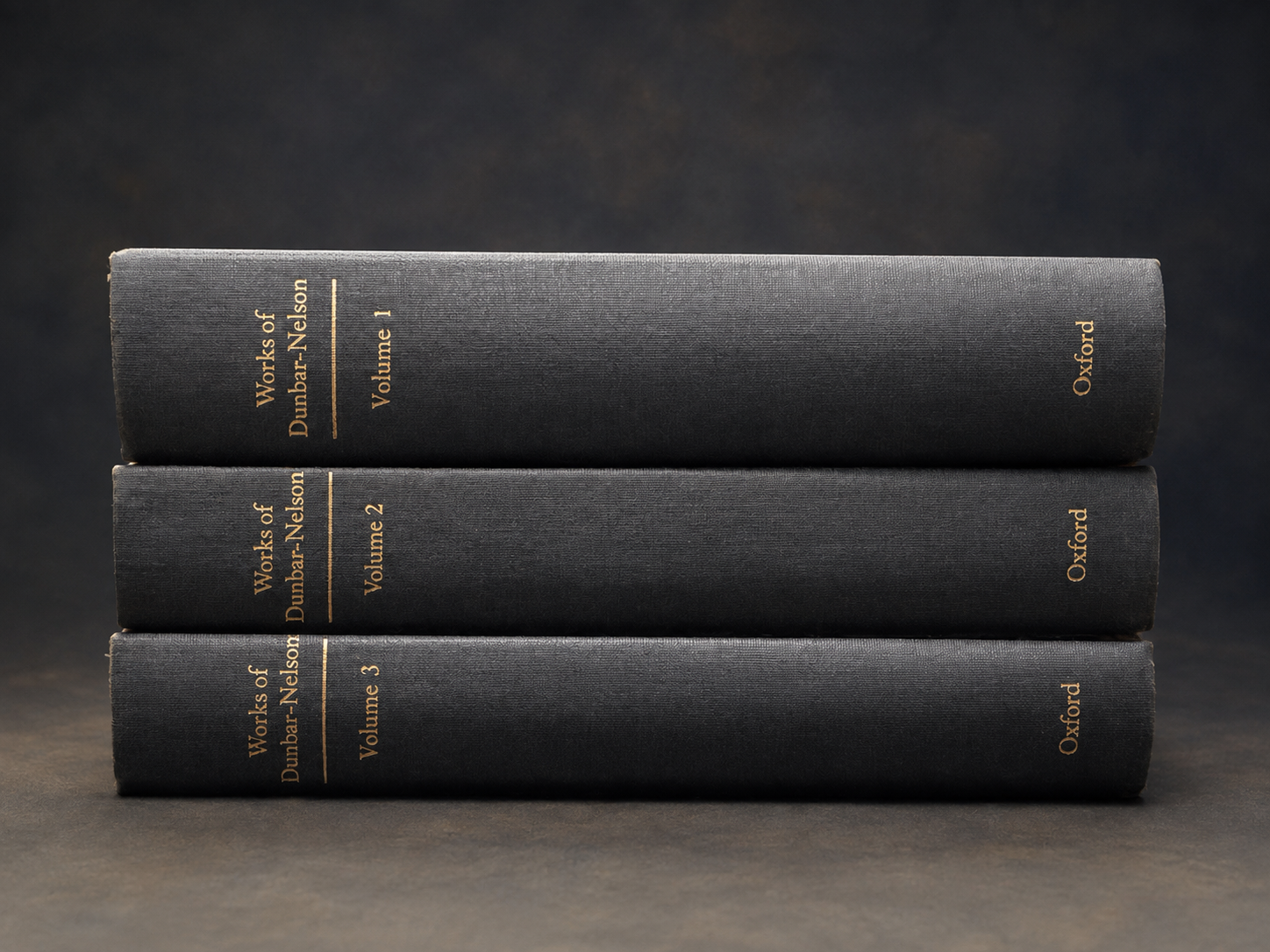 The Works of Alice Dunbar-Nelson complete three-volume Oxford set stacked with all gold-lettered spines visible.