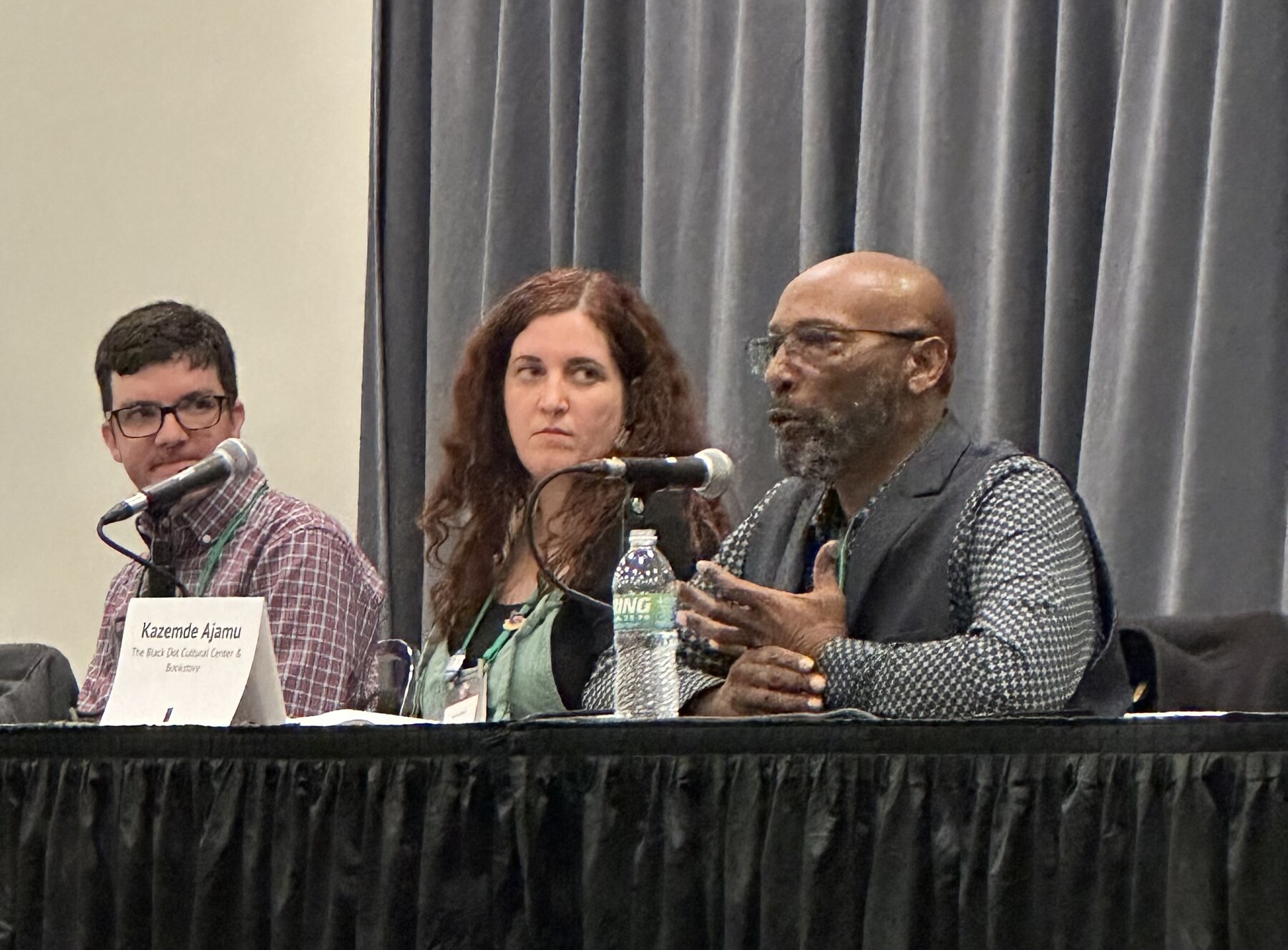 Kazemde Ajamu speaking during a publishing discussion