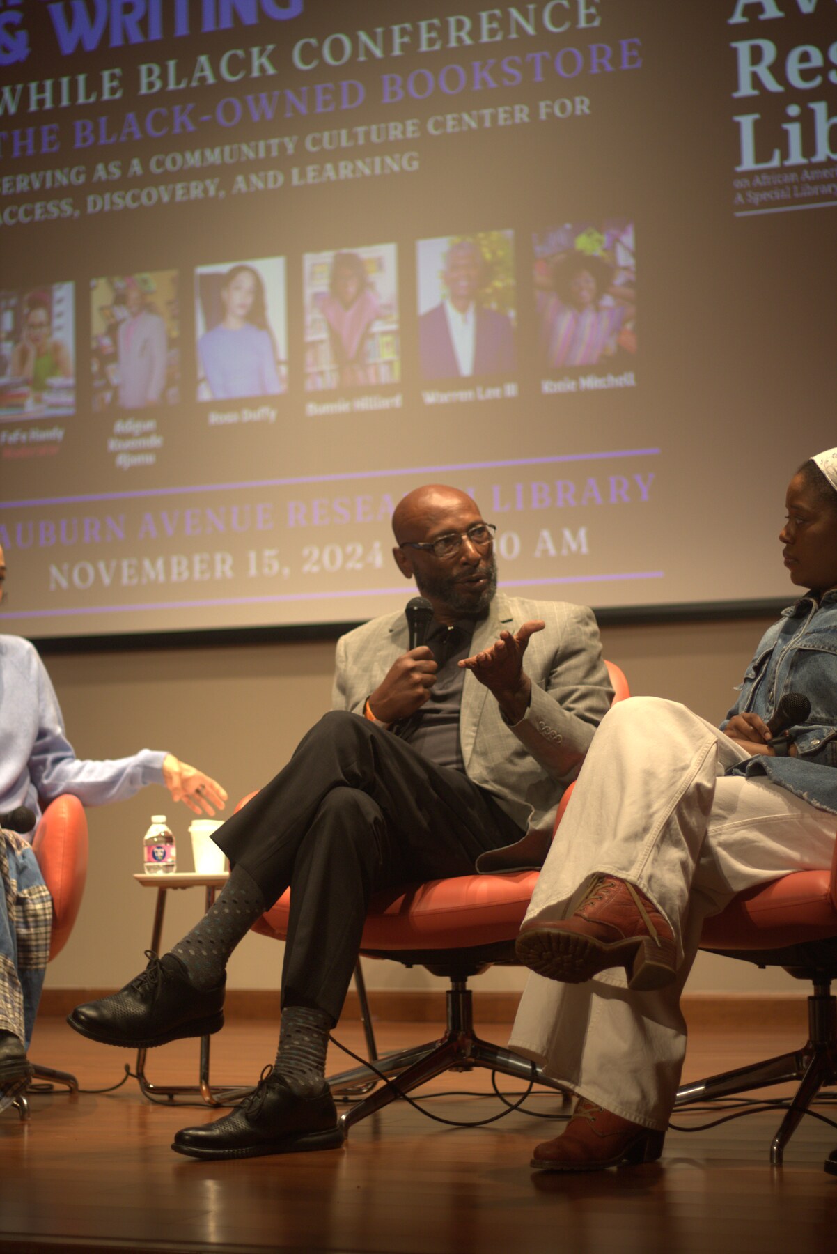 Kazemde Ajamu speaking on a panel at the Collecting, Researching, and Writing While Black Conference at Auburn Avenue Research Library in 2024.