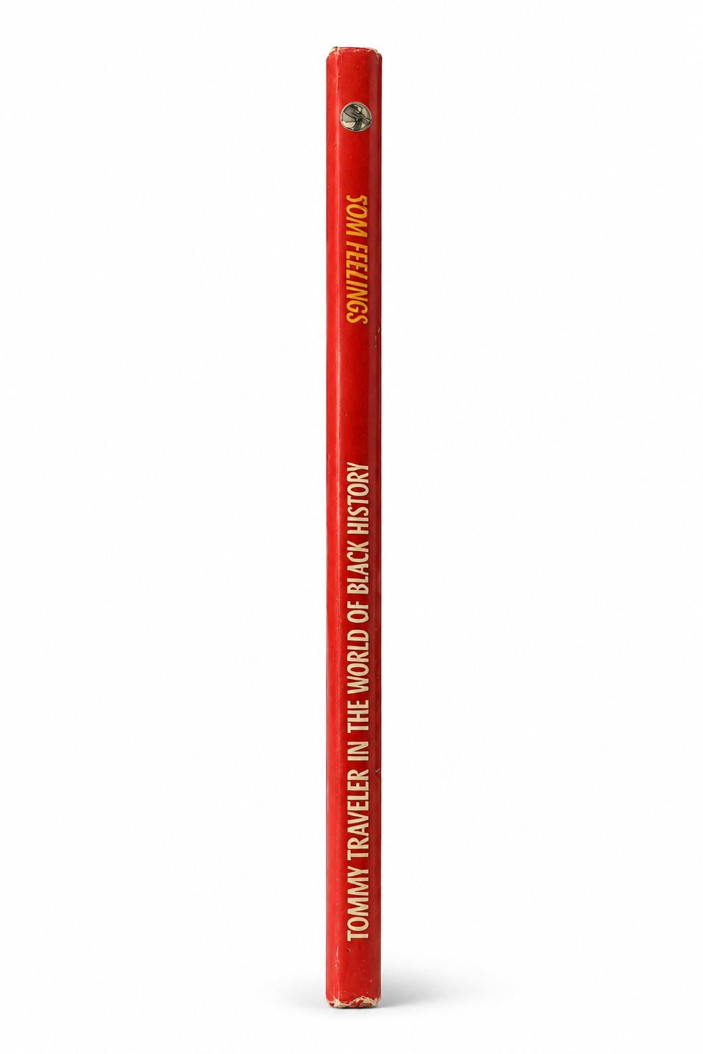 Spine of the 1991 first edition of Tommy Traveler in the World of Black History by Tom Feelings.